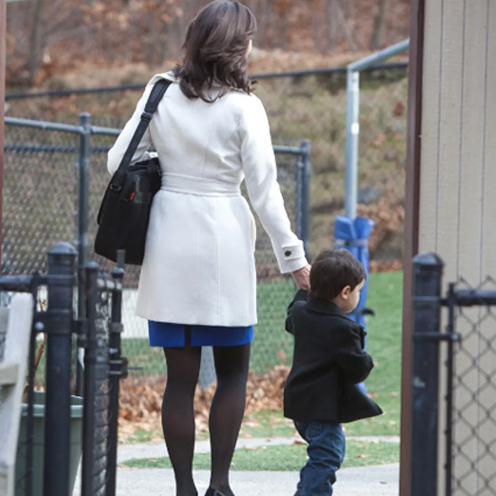 A child being dropped off at Bright Beginnings Academy daycare by his mother