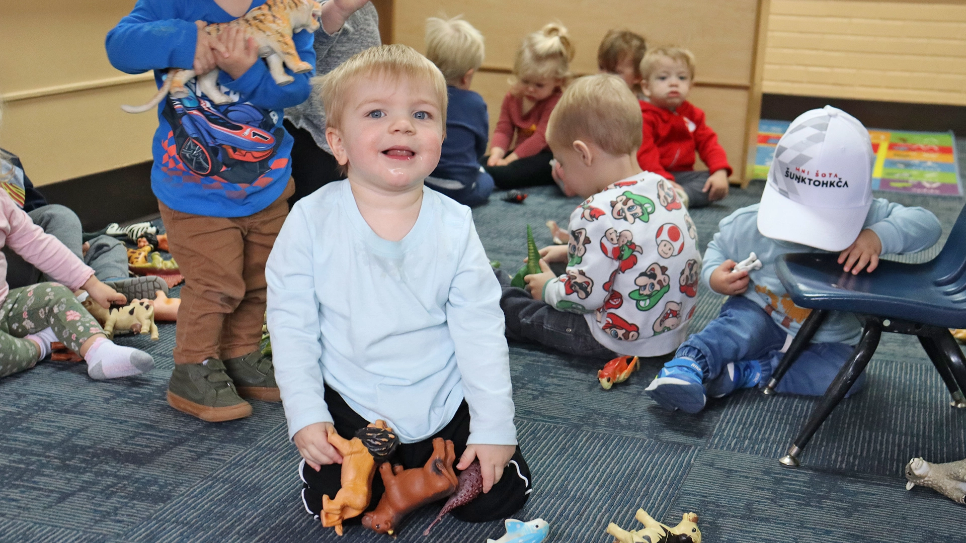 Children playing with animal figures at Bright Beginnings Academy.