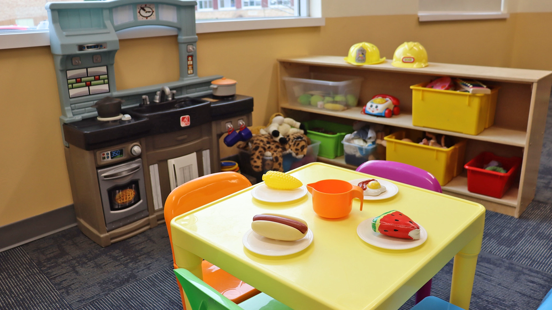 The playroom at Bright Beginnings Academy with a play lunch table.