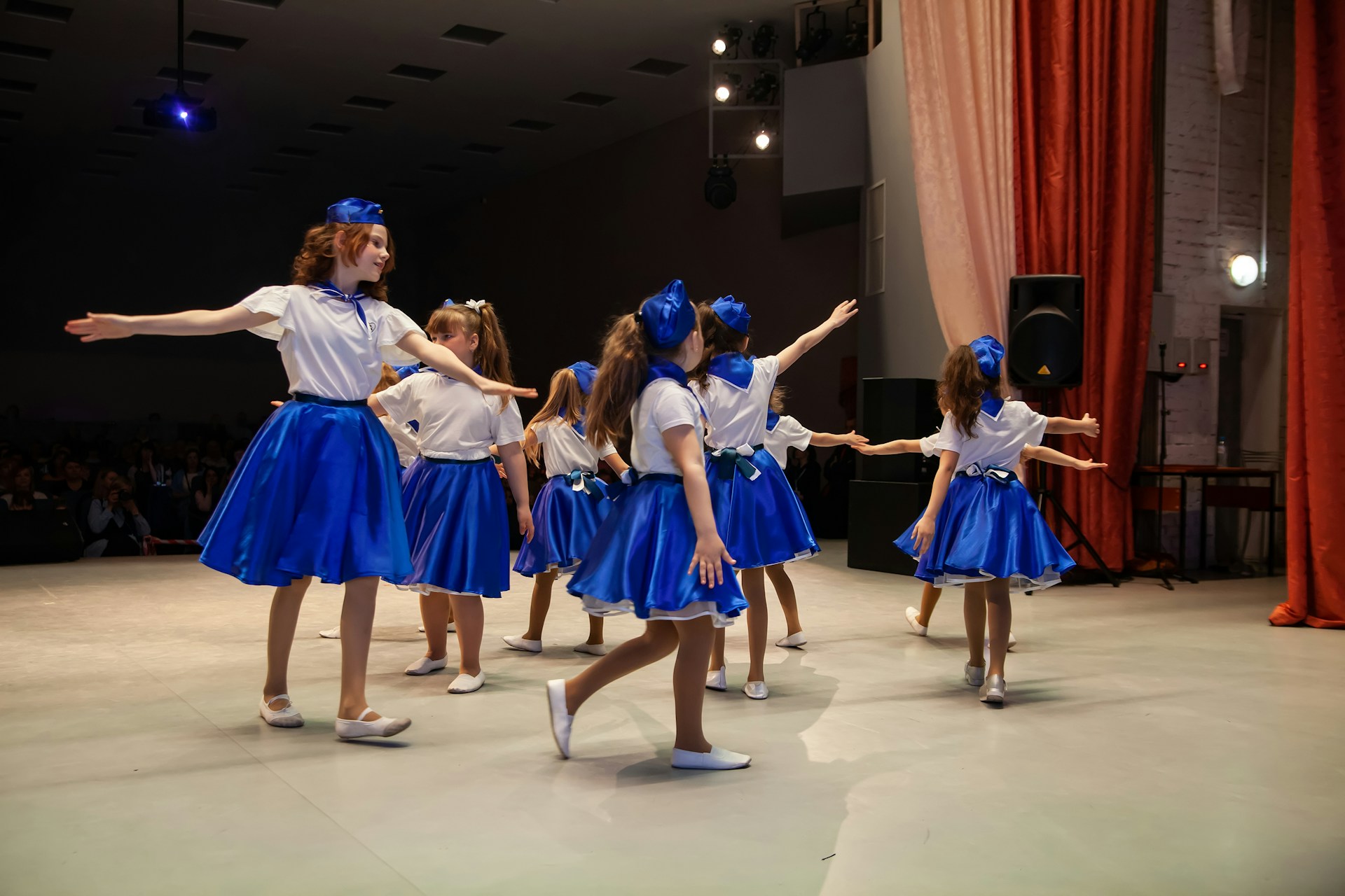 Group of girls dancing in matching dresses