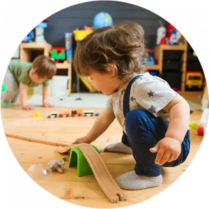 A child using a ramp toy to play at a Bright Beginnings Academy daycare